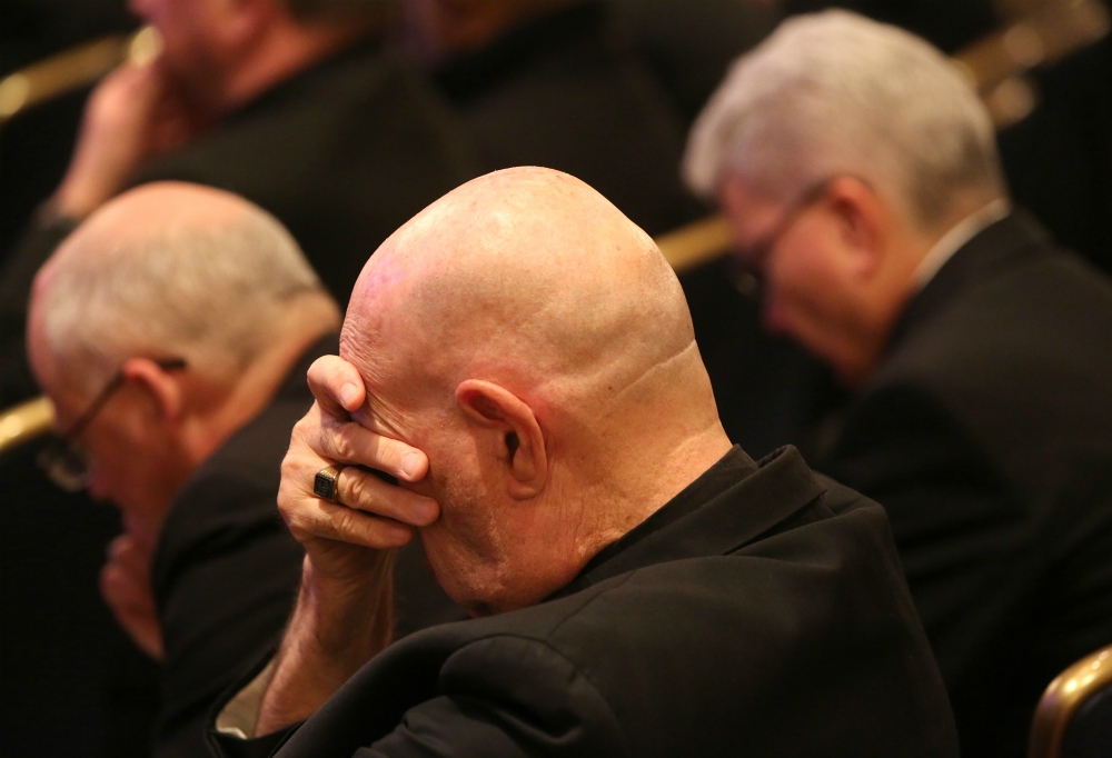Bishops pray before the Blessed Sacrament in the chapel during a day of prayer Nov. 12, 2018, before hearing from abuse survivors at their fall general assembly in Baltimore. (CNS/Bob Roller)