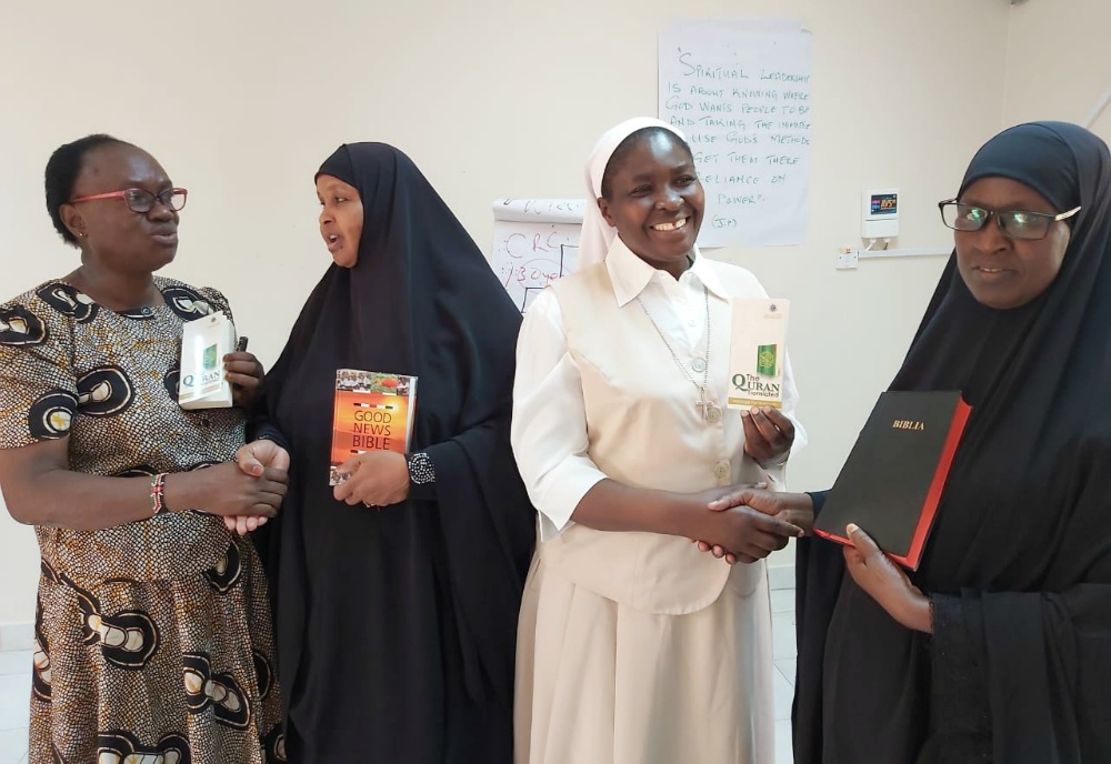A Catholic woman and nun exchange holy books with Muslim women leaders Dec. 13, 2019, in Garissa, Kenya. (CNS/Courtesy of Fr. Nicholas Mutua) A Catholic woman and nun exchange holy books with Muslim women leaders Dec. 13, 2019, in Garissa, Kenya. (CNS/Courtesy of Fr. Nicholas Mutua)