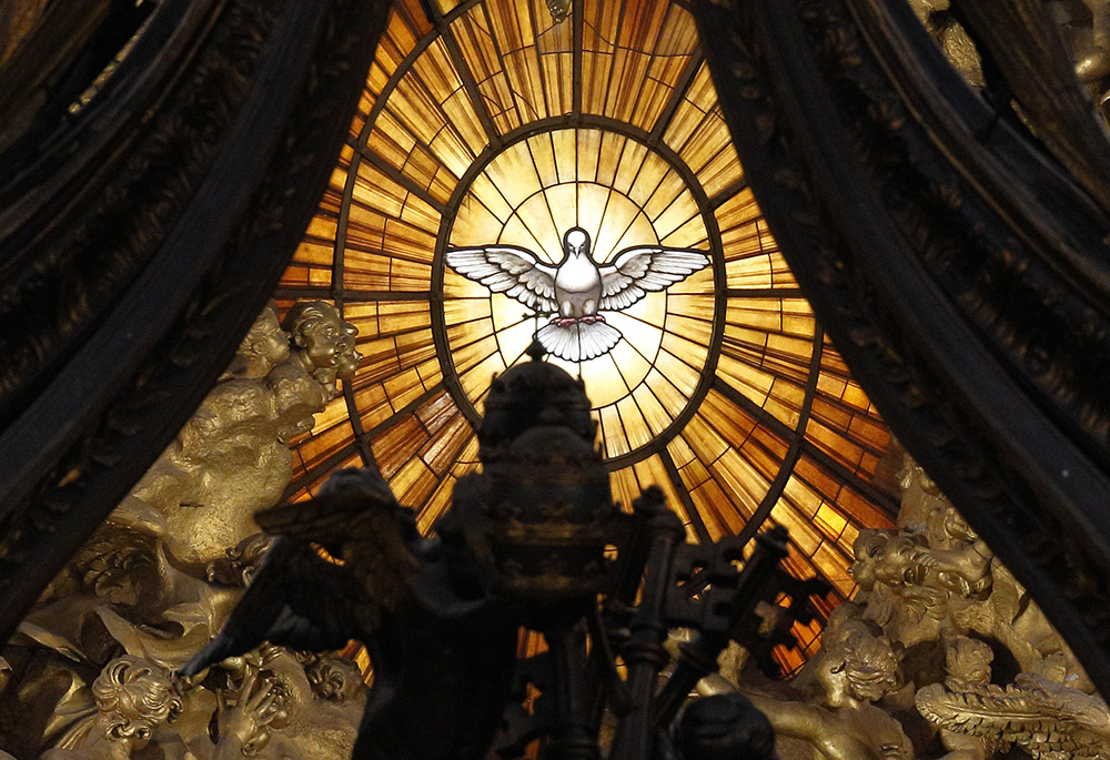 The Holy Spirit window is pictured through the Baldacchino in St. Peter's Basilica at the Vatican. (CNS/Paul Haring) The Holy Spirit window is pictured through the Baldacchino in St. Peter's Basilica at the Vatican. (CNS/Paul Haring)