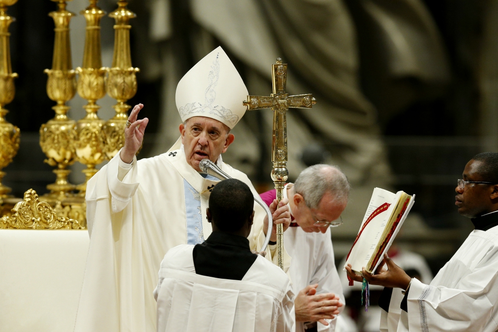 Pope Francis delivers his blessing as he celebrates Mass on the feast of Mary, Mother of God, in St. Peter’s Basilica at the Vatican Jan. 1. (CNS/Paul Haring)