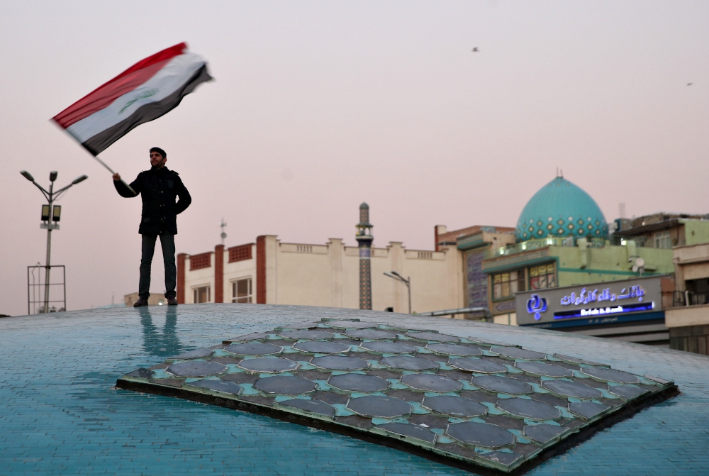 A man celebrates in Tehran, Iran, Jan. 8 after the country launched missiles at U.S.-led forces in Iraq. (CNS/West Asia News Agency via Reuters/Nazanin Tabatabaee) A man celebrates in Tehran, Iran, Jan. 8 after the country launched missiles at U.S.-led forces in Iraq. (CNS/West Asia News Agency via Reuters/Nazanin Tabatabaee)
