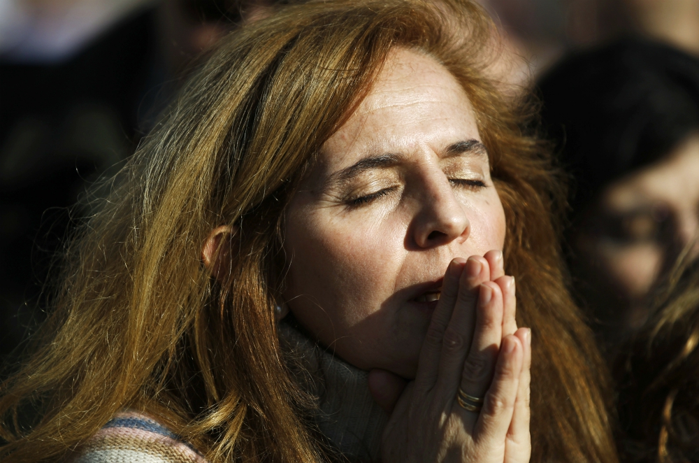 A woman prays during Mass in favor of the traditional family unit in central Madrid in this 2011 file photo. (CNS/Reuters/Susana Vera) A woman prays during Mass in favor of the traditional family unit in central Madrid in this 2011 file photo. (CNS/Reuters/Susana Vera)