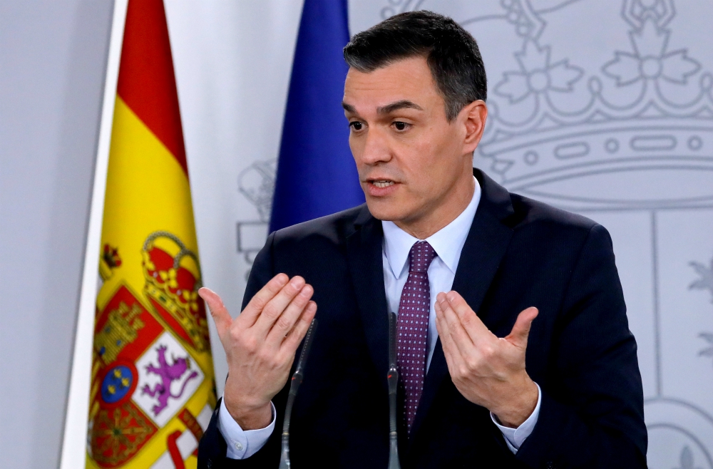 Spanish Prime Minister Pedro Sanchez gestures at a news conference after the first Cabinet meeting at Moncloa Palace in Madrid Jan. 14. (CNS/Reuters/Jon Nazca) 