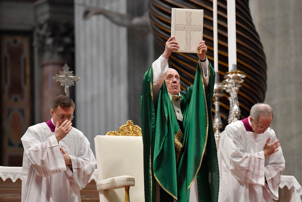 Pope Francis holds up the Lectionary used during Vatican II Pope Francis holds up the Lectionary (or book of Mass readings) that was used during the Second Vatican Council, Jan. 26, 2020, in St. Peter's Basilica, the first Sunday of the Word of God, encouraging Catholics to read the Bible. (CNS/Vatican Media)