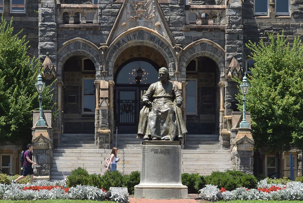 This statue of Georgetown University's founder, Bishop John Carroll, greets students at the Washington campus entrance July 22, 2019. (CNS/Elizabeth Bachmann) This statue of Georgetown University's founder, Bishop John Carroll, greets students at the Washington campus entrance July 22, 2019. (CNS/Elizabeth Bachmann)