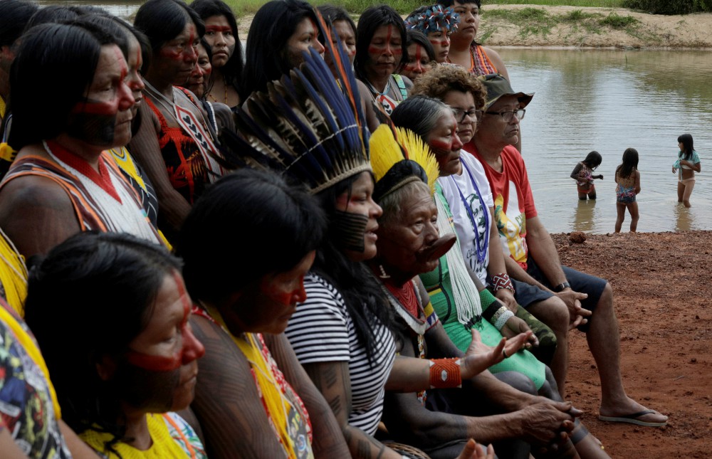 Indigenous people are seen on the banks of the Xingu River during a media event in Brazil's Xingu Indigenous Park Jan. 15, 2020. (CNS/Reuters/Ricardo Moraes)