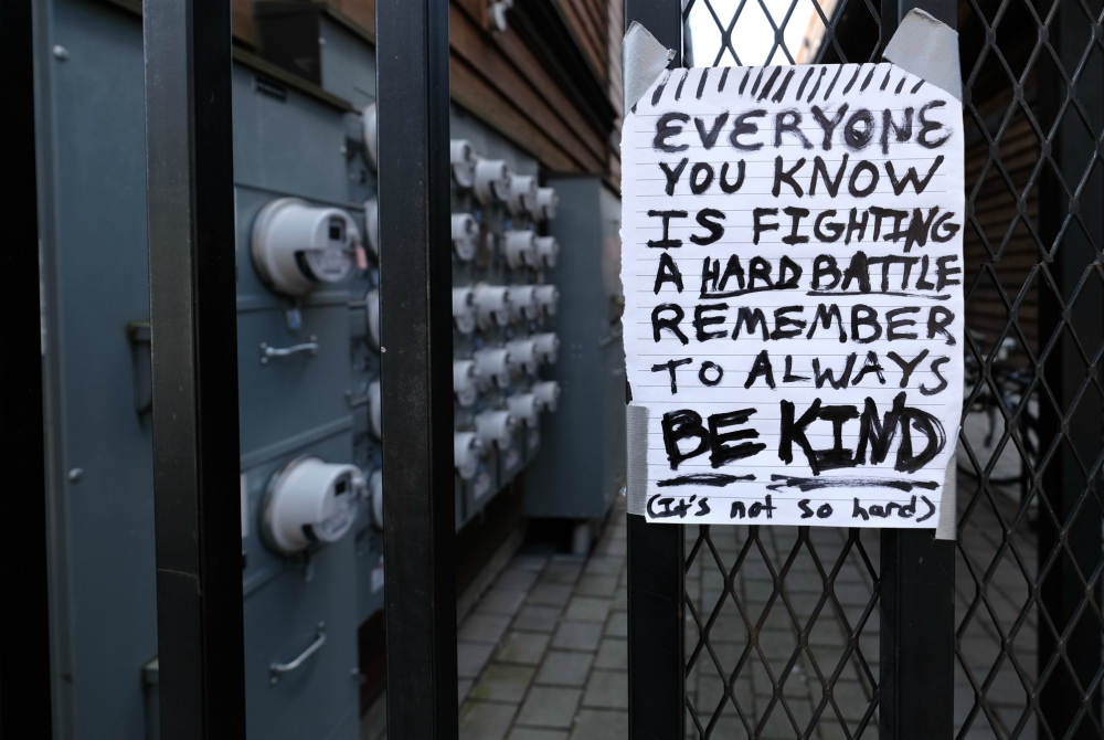 Pedestrians walking along Mississippi Avenue March 18 in Portland, Oregon, could see this handwritten message that acknowledged people are frightened amid the coronavirus pandemic but encouraged them to be kind to one another. (CNS/Reuters)