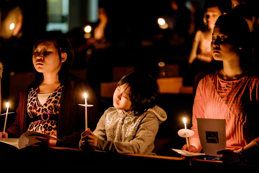 Young people hold candles during the Easter Vigil at the Cathedral of St. Joseph in Hartford, Connecticut, April 4, 2015. (CNS/Bob Mullen)