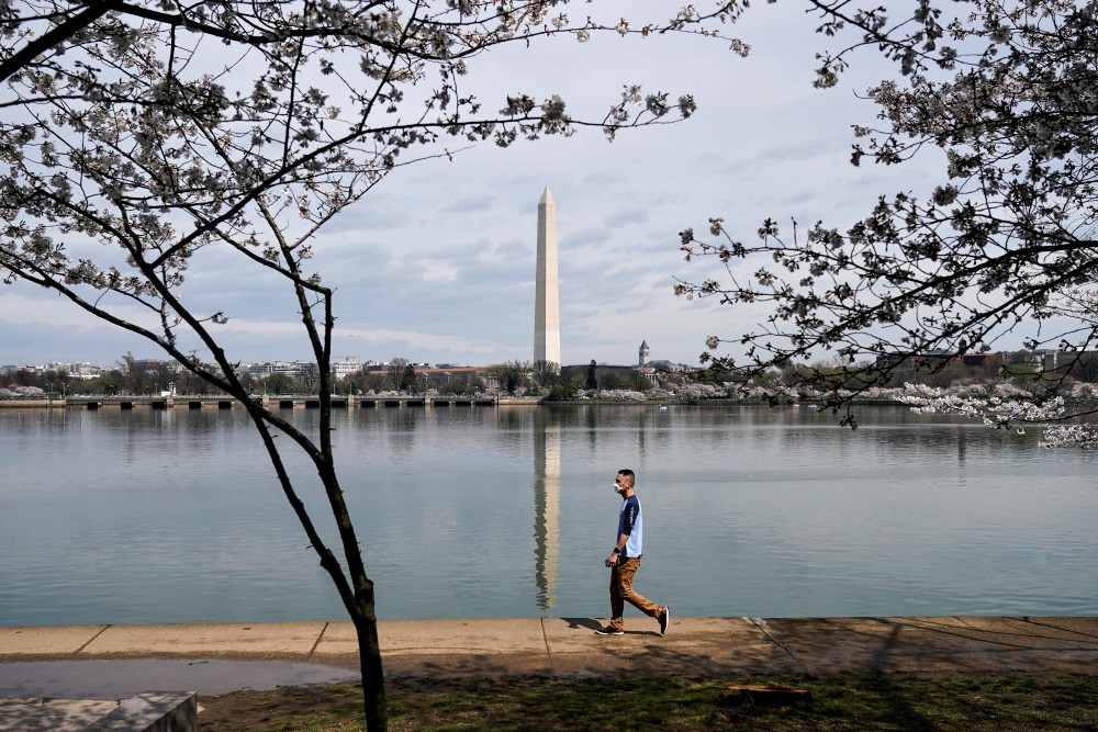A man in Washington wears a face mask during the outbreak of coronavirus March 19. (CNS/Reuters/Joshua Roberts)
