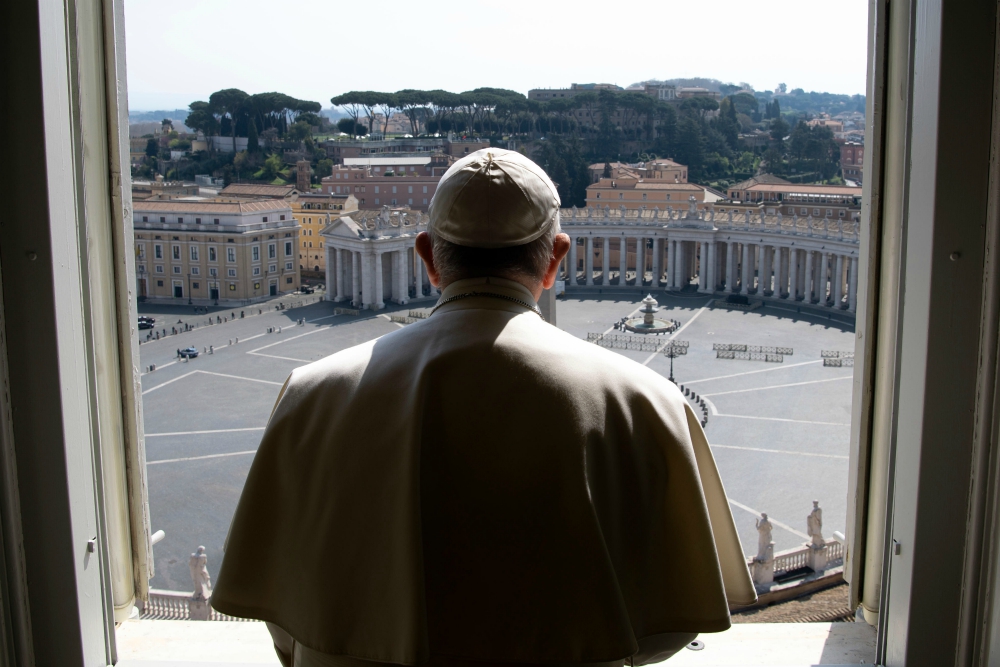 Pope Francis looks over an empty St. Peter's Square after leading a livestream of the recitation of the Angelus from the library of the Apostolic Palace March 22. (CNS/Vatican Media) Pope Francis looks over an empty St. Peter's Square after leading a livestream of the recitation of the Angelus from the library of the Apostolic Palace March 22. (CNS/Vatican Media)