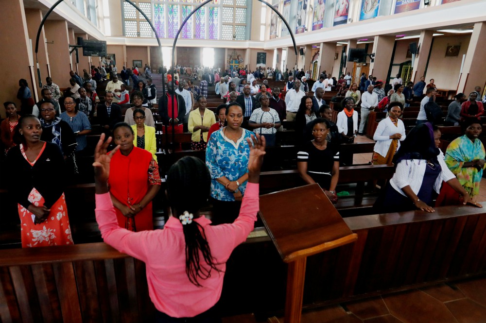 Worshipers pray during a Mass at the Cathedral Basilica of the Holy Family in Nairobi, Kenya, March 22, amid concerns about the spread of the coronavirus disease. (CNS/Reuters/Thomas Mukoya)
