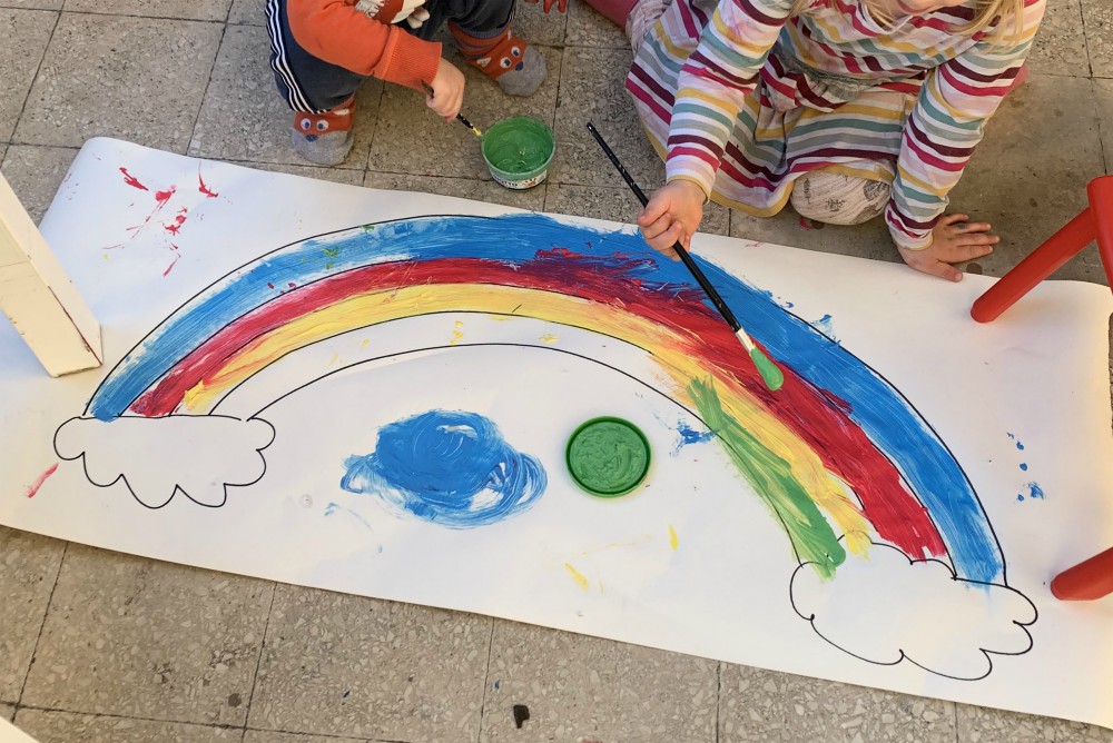 Joanna Kohorst's young children paint a rainbow on a large piece of paper during the lockdown that began March 10 in Rome because of the coronavirus pandemic. Someone also drew on a wall, so the markers are on a special lockdown within the lockdown. (CNS) Joanna Kohorst's young children paint a rainbow on a large piece of paper during the lockdown that began March 10 in Rome because of the coronavirus pandemic. Someone also drew on a wall, so the markers are on a special lockdown within the lockdown. (CNS)