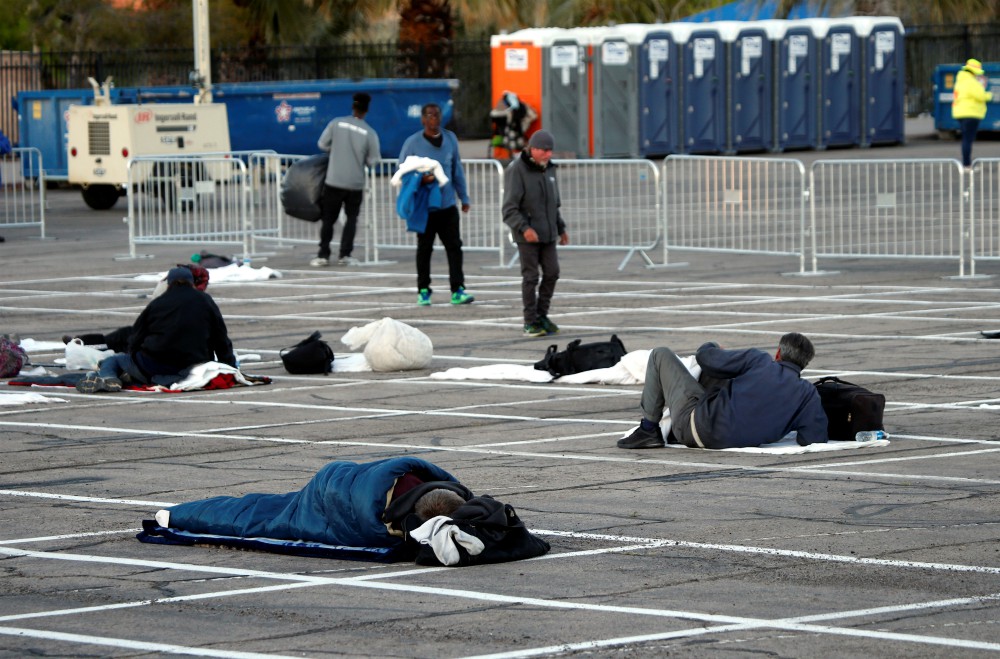 Homeless people practice social distancing in a parking lot in Las Vegas during the coronavirus pandemic March 30. (CNS/Reuters/Steve Marcus)