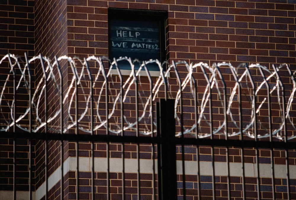 Signs made by Cook County Jail prisoners in Chicago plead for help April 7 during the coronavirus pandemic. (CNS/Reuters/Jim Vondruska)