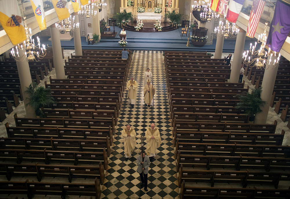New Orleans Archbishop Gregory Aymond celebrates an Easter Mass which was livestreamed from St. Louis Cathedral St. Louis Cathedral April 12, 2020, during the coronavirus pandemic. The archdiocese filed for Chapter 11 reorganization May 1, 2020. (CNS) New Orleans Archbishop Gregory Aymond celebrates an Easter Mass which was livestreamed from St. Louis Cathedral St. Louis Cathedral April 12, 2020, during the coronavirus pandemic. The archdiocese filed for Chapter 11 reorganization May 1, 2020. (CNS)