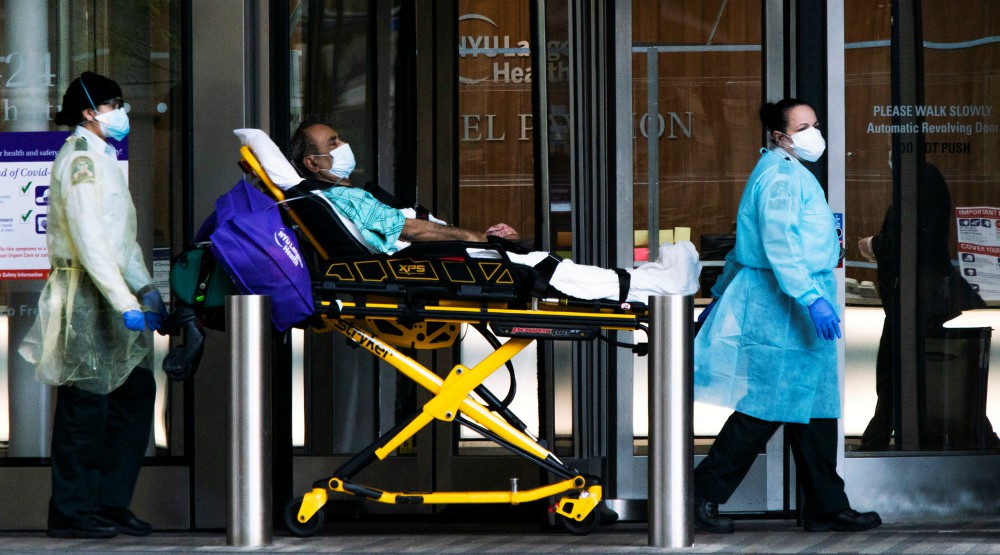 Health care workers move a patient at NYU Langone Hospital in New York City May 3, amid the coronavirus pandemic. (CNS/Reuters/Eduardo Munoz)