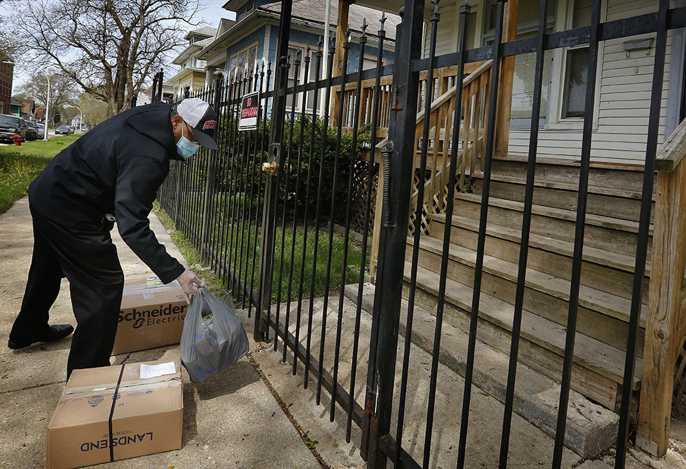 Chicago Deacon Pablo Perez of Kolbe House drops off donations at a halfway house for men recently released from jail May 4, 2020. (CNS/Chicago Catholic/Karen Callaway)