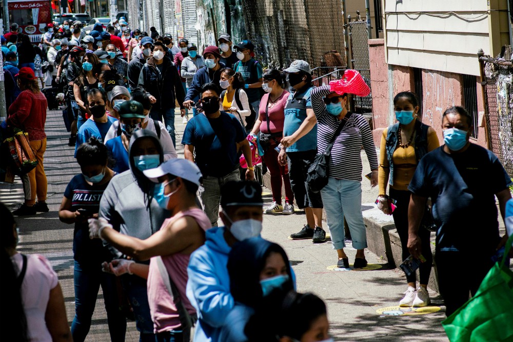 People in the Queens borough of New York City line up during a food distribution May 16. (CNS/Reuters/Eduardo Munoz) People in the Queens borough of New York City line up during a food distribution May 16. (CNS/Reuters/Eduardo Munoz)