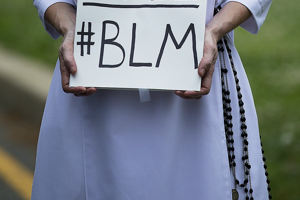 A Dominican sister protests racial injustice June 2 in Washington, D.C. (CNS/Tyler Orsburn)