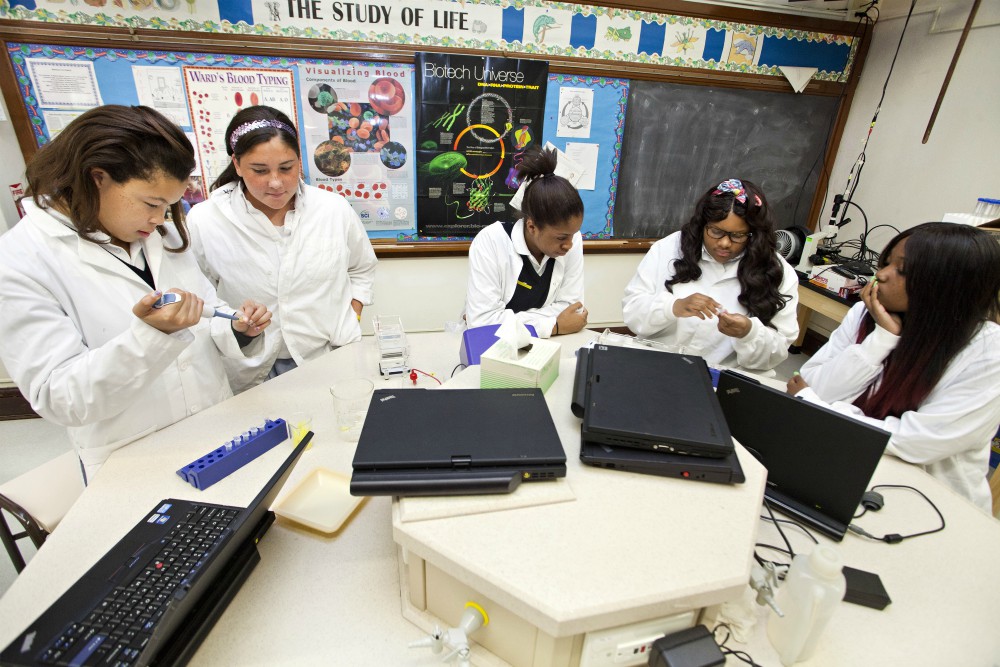 Students play the roles of DNA analysts working in a forensic lab at the Institute of Notre Dame in Baltimore, in this 2012 file photo. (CNS/Catholic Review)