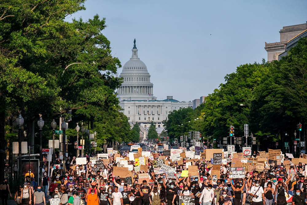 Demonstrators protesting racial injustice in Washington march down Constitution Avenue June 13, 2020. In a webinar, Rudy Dehaney, coordinator of youth and young adult ministry for the Northeast Catholic Community in Baltimore, said young adult ministers n