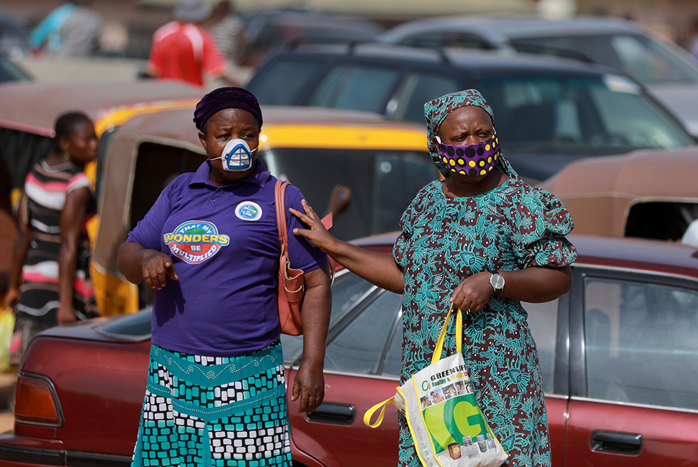 Women in Abuja, Nigeria, wear face masks May 2, 2020, during the coronavirus pandemic. (CNS/Reuters/Afolabi Sotunde)