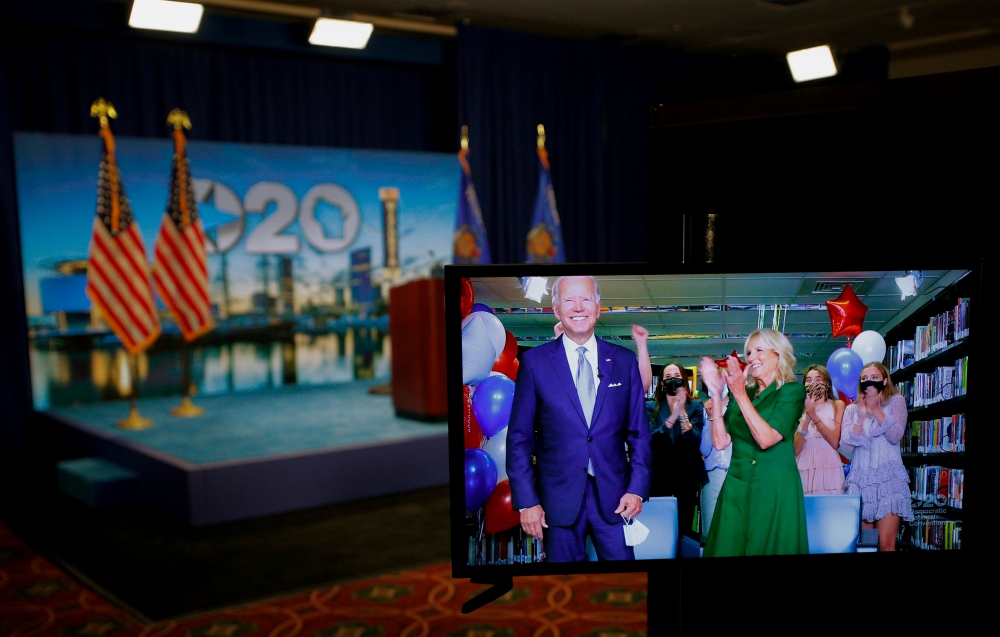 The Democratic presidential nominee, former Vice President Joe Biden, and his wife, Jill Biden, are seen in a video feed from Delaware after winning the votes to become the party's 2020 nominee for president Aug. 18. (CNS/Brian Snyder, Pool via Reuters)