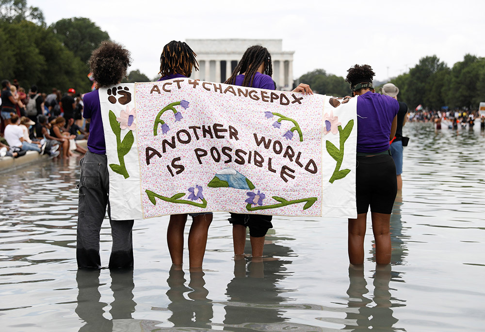 Demonstrators gather in front of the Lincoln Memorial for the Aug. 28, 2020, "Get Your Knee Off Our Necks" March on Washington 2020 in support of racial justice. (CNS/Reuters/Andrew Kelly) Demonstrators gather in front of the Lincoln Memorial for the Aug. 28, 2020, "Get Your Knee Off Our Necks" March on Washington 2020 in support of racial justice. (CNS/Reuters/Andrew Kelly)