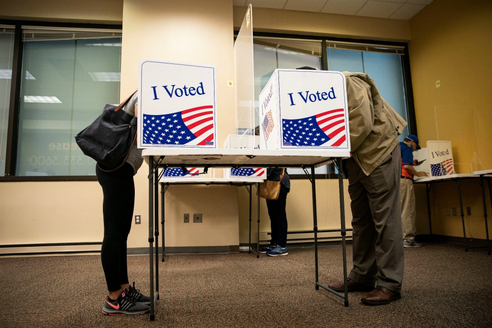 People fill out their ballots at an early voting site in Arlington, Virginia, Sept. 18. (CNS/Reuters/Al Drago)