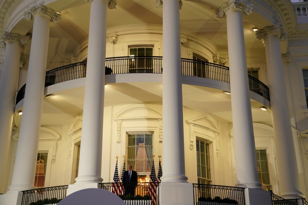 President Donald Trump poses atop the Truman Balcony of the White House in Washington Oct. 5. (CNS/Reuters/Erin Scott)