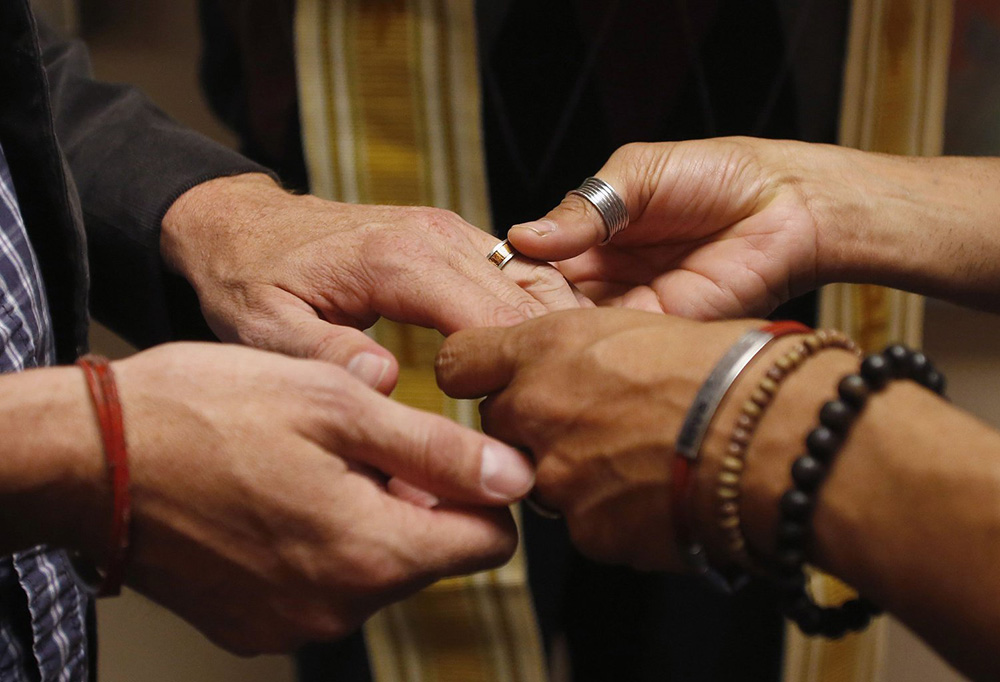 A file photo shows a same-sex couple exchanging rings during a ceremony in Salt Lake City. (CNS/Reuters/Jim Urquhar) A file photo shows a same-sex couple exchanging rings during a ceremony in Salt Lake City. (CNS/Reuters/Jim Urquhar)