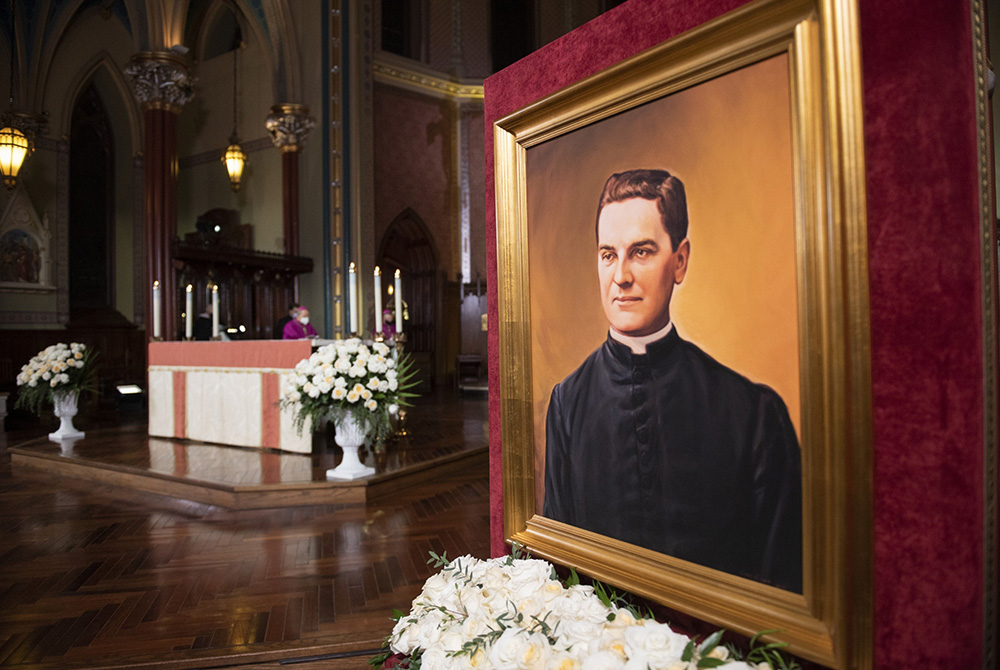 A portrait of Blessed Michael McGivney, founder of the Knights of Columbus, is displayed during a prayer vigil at St. Mary's Church in New Haven, Connecticut, Oct. 30, 2020, the eve of his beatification. (CNS/Courtesy of Knights of Columbus)