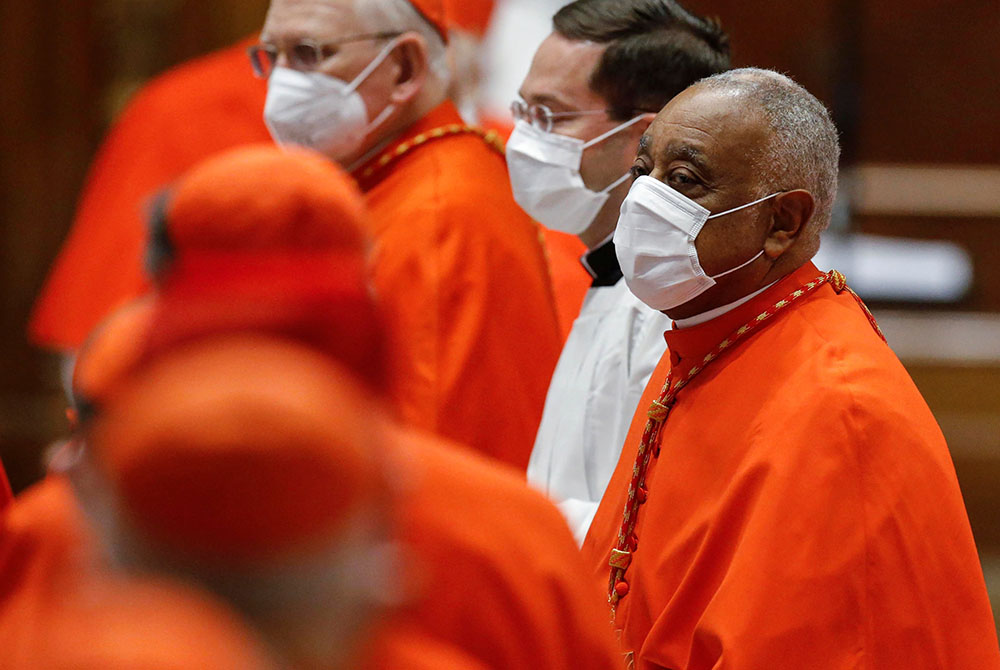 Cardinal Wilton Gregory of Washington wears a protective mask as he attends a consistory led by Pope Francis in St. Peter's Basilica Nov. 28 at the Vatican. Gregory was among 13 new cardinals created by the pope. (CNS/Fabio Frustaci, Reuters pool) Cardinal Wilton Gregory of Washington wears a protective mask as he attends a consistory led by Pope Francis in St. Peter's Basilica Nov. 28 at the Vatican. Gregory was among 13 new cardinals created by the pope. (CNS/Fabio Frustaci, Reuters pool)