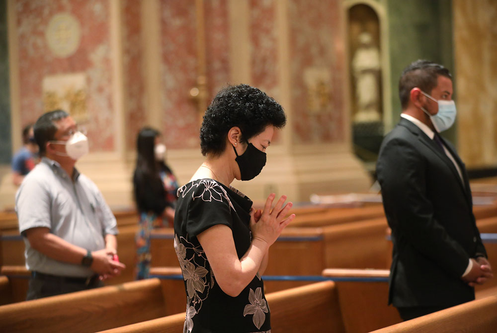People pray during a 2020 Mass at the Cathedral of St. Matthew the Apostle in Washington. (CNS/Andrew Biraj, Catholic Standard)