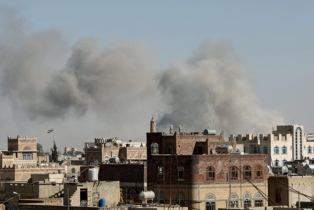 Smoke billows from the sites of Saudi-led airstrikes in Sanaa, Yemen, Nov. 27, 2020. During his Jan. 1 Angelus, Pope Francis offered prayers for the people of war-torn Yemen, especially the nation's children left without education and often without food b