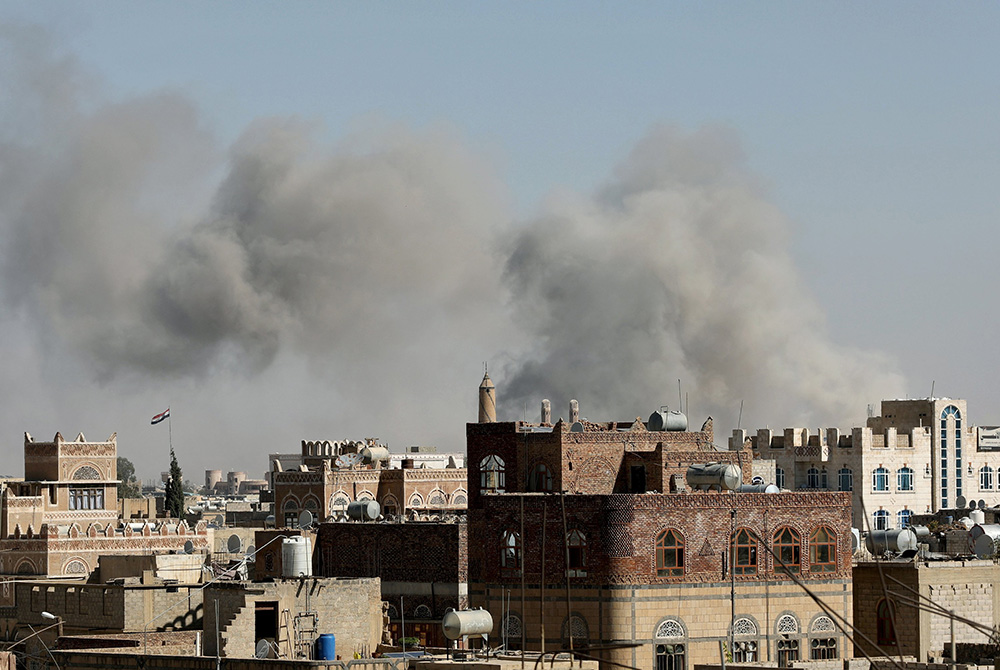 Smoke billows from the sites of Saudi-led airstrikes in Sanaa, Yemen, Nov. 27, 2020. During his Jan. 1 Angelus, Pope Francis offered prayers for the people of war-torn Yemen, especially the nation's children left without education and often without food b Smoke billows from the sites of Saudi-led airstrikes in Sanaa, Yemen, Nov. 27, 2020. During his Jan. 1 Angelus, Pope Francis offered prayers for the people of war-torn Yemen, especially the nation's children left without education and often without food b