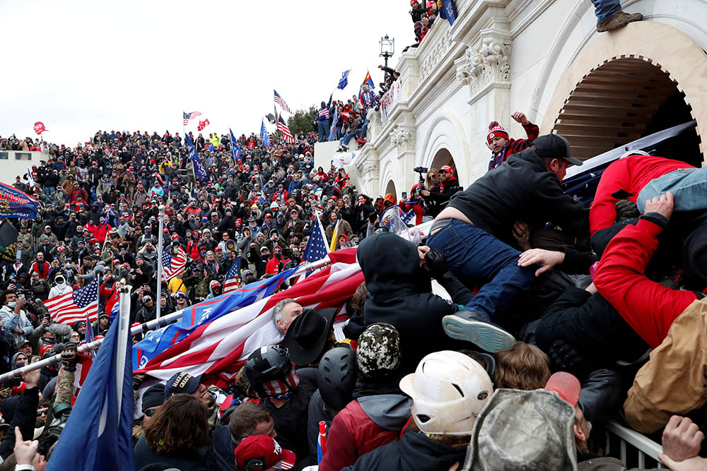 President Donald Trump supporters storm into the U.S. Capitol in Washington Jan. 6 during a rally to contest the certification of the 2020 presidential election. (CNS/Reuters/Shannon Stapleton)