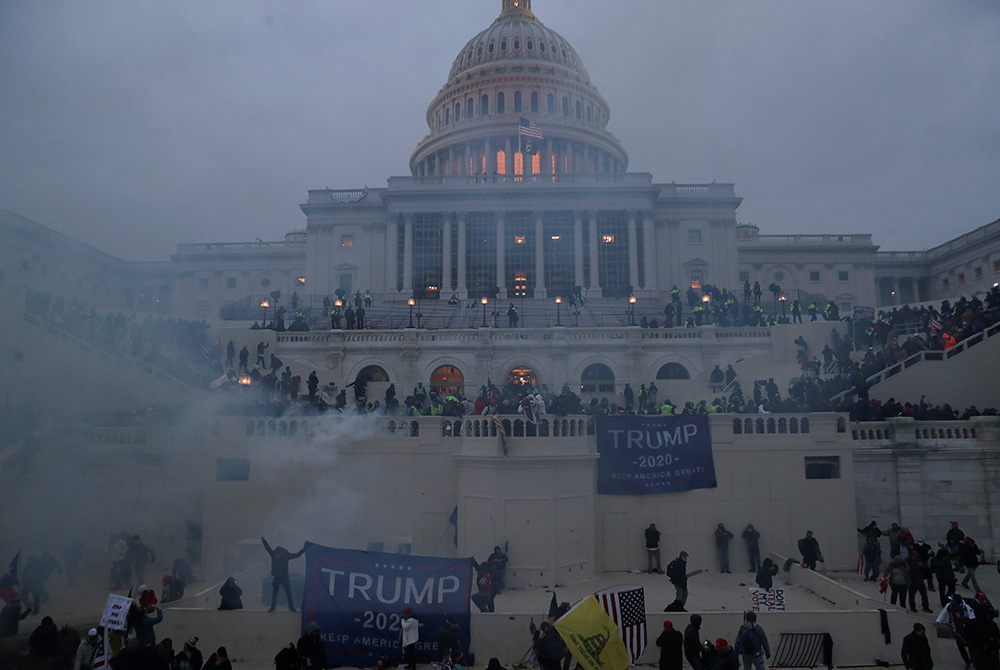 Police officers in Washington stand guard Jan. 6, 2021, as supporters of President Donald Trump gather in front of the U.S. Capitol. (CNS/Leah Millis, Reuters) Police officers in Washington stand guard Jan. 6, 2021, as supporters of President Donald Trump gather in front of the U.S. Capitol. (CNS/Leah Millis, Reuters)