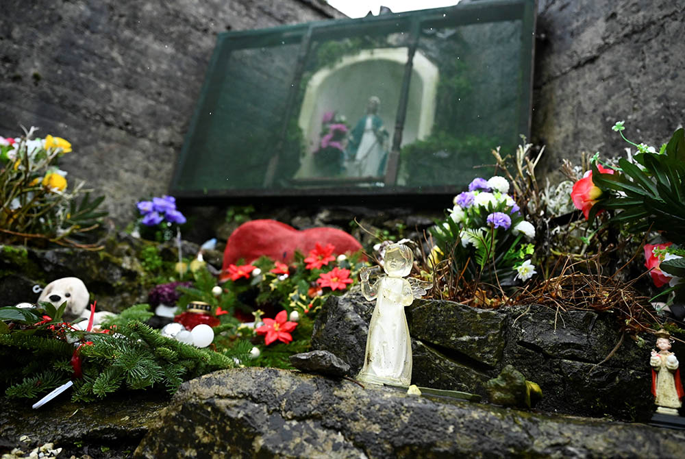 An angel and statue of Mary are pictured at a cemetery in Tuam, Ireland, where the bodies of nearly 800 infants were uncovered at the site of a former Catholic home for unmarried mothers and their children. The photo was taken Jan. 12, the day a commissio