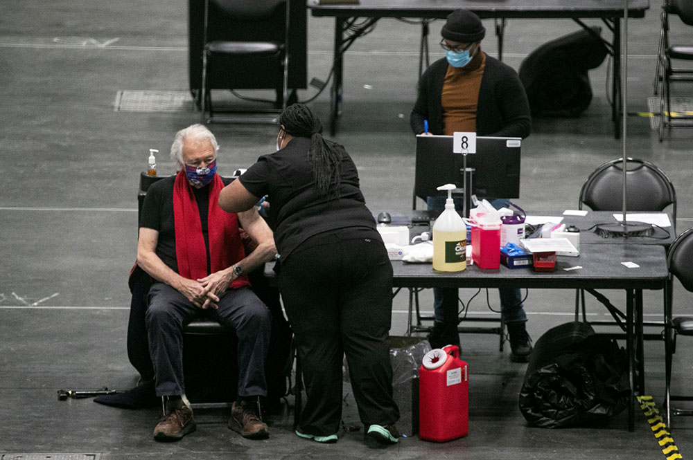 A man at the New York state COVID-19 vaccination site, the Jacob K. Javits Convention Center in New York City, receives a dose of the coronavirus vaccine Jan. 13. (CNS/Reuters/Brendan McDermid) A man at the New York state COVID-19 vaccination site, the Jacob K. Javits Convention Center in New York City, receives a dose of the coronavirus vaccine Jan. 13. (CNS/Reuters/Brendan McDermid)