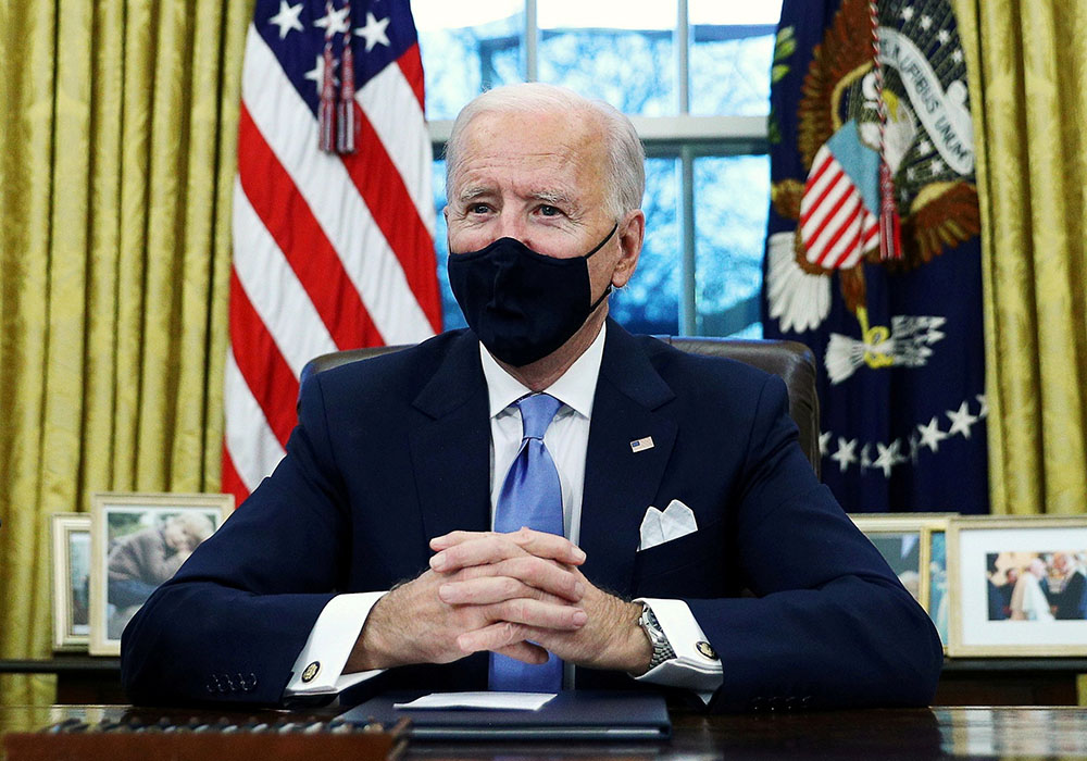 President Joe Biden at the White House in Washington Jan. 20, after his inauguration as the 46th president of the United States. At right (CNS/Reuters/Tom Brenner) President Joe Biden at the White House in Washington Jan. 20, after his inauguration as the 46th president of the United States. At right (CNS/Reuters/Tom Brenner)