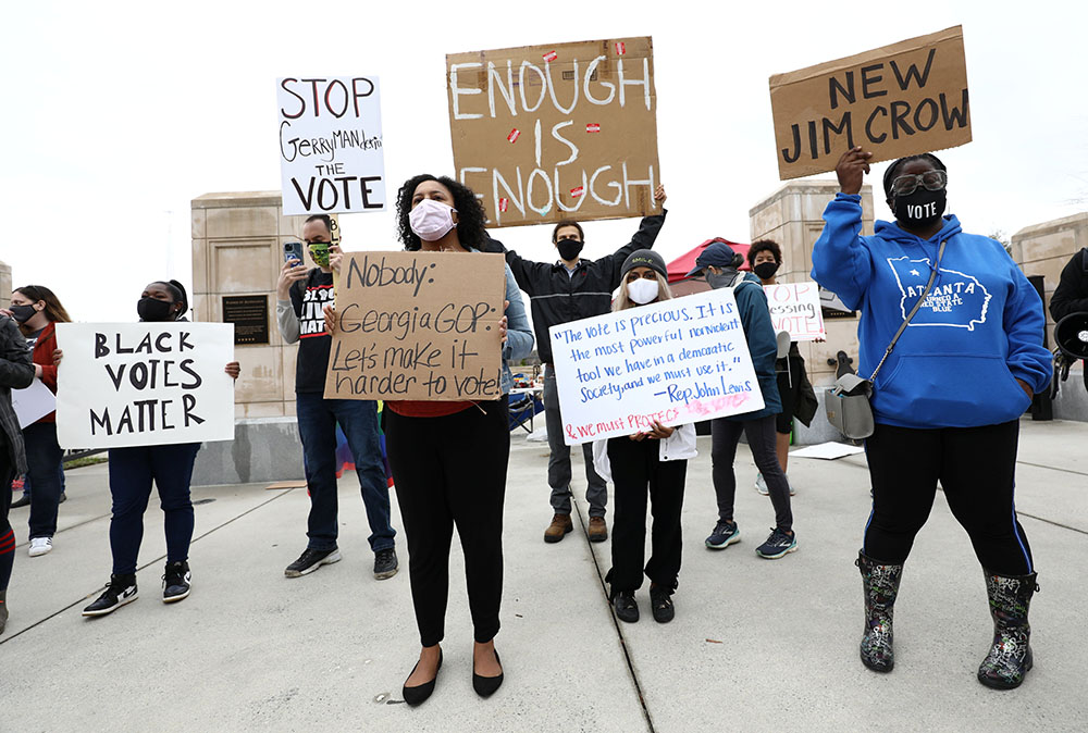 Demonstrators in Atlanta gather outside the Georgia State Capitol March 1 to protest H.B. 531, passed by the Georgia House to restrict ballot drop boxes, require more I.D. for absentee voting and limit weekend early voting days passed. (CNS/Reuters)