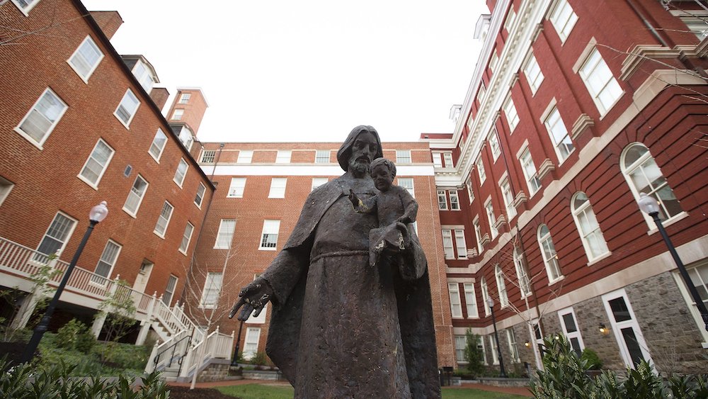 : Isaac Hawkins Hall is seen on the campus of Georgetown University April 4, 2017. The hall, previously known as Mulledy Hall and later Freedom Hall, was renamed in 2017 for one of the 272 enslaved men, women and children sold by Georgetown's Jesuit commu