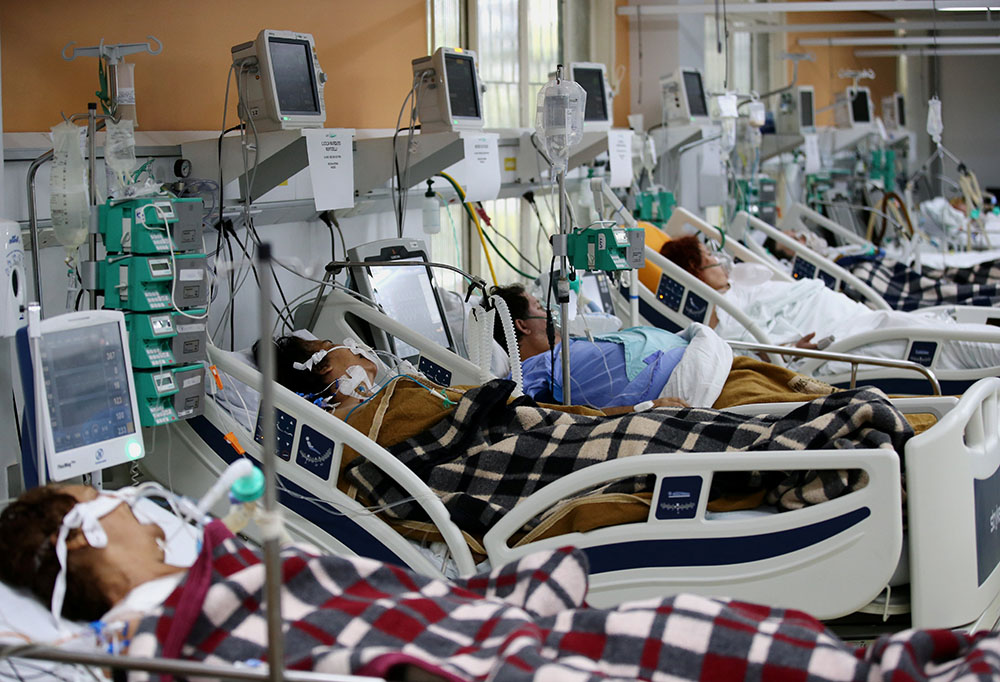 Patients in the emergency room of the Nossa Senhora da Conceição hospital in Porto Alegre, Brazil March 11. The emergency room is overcrowded because of the spike in COVID-19 cases. (CNS/Reuters/Diego Vara)