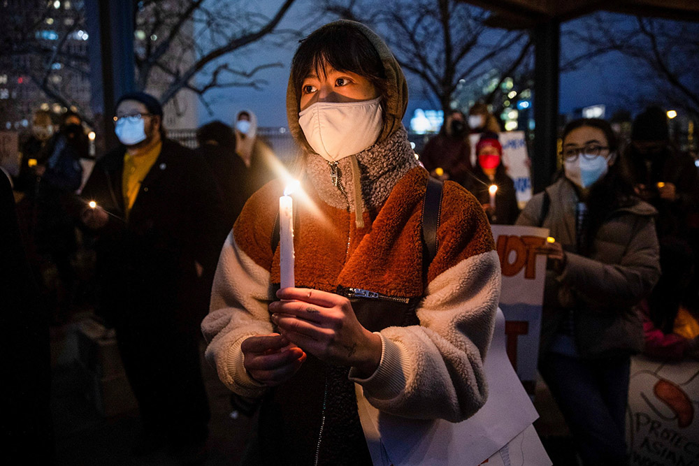 People in Philadelphia attend a vigil in solidarity with the Asian American community March 17. (CNS/Reuters/Rachel Wisniewski)
