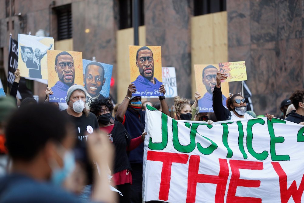 Demonstrators in Minneapolis march on the first day of the trial of former police officer Derek Chauvin March 29. (CNS/Reuters/Octavio Jones) Demonstrators in Minneapolis march on the first day of the trial of former police officer Derek Chauvin March 29. (CNS/Reuters/Octavio Jones)