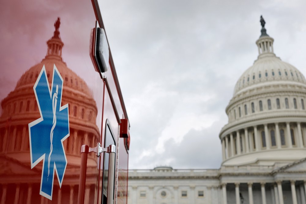 The U.S. Capitol is reflected on an ambulance July 16, 2020, in Washington. (CNS/Tom Brenner, Reuters)