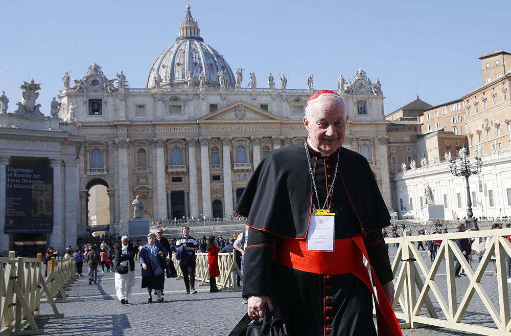 Cardinal Marc Ouellet, prefect of the Congregation for Bishops, walks through St. Peter's Square at the Vatican in February 2019. (CNS/Paul Haring)