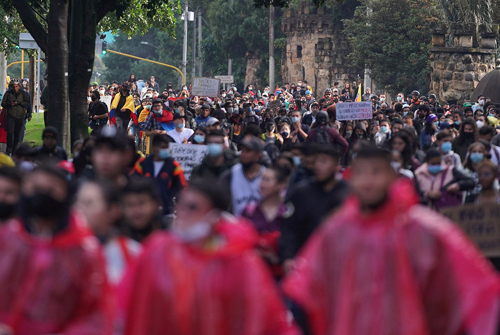 Demonstrators participate in a protest against poverty and police violence May 4 in Bogota, Colombia. (CNS/Nathalia Angarita, Reuters) Demonstrators participate in a protest against poverty and police violence May 4 in Bogota, Colombia. (CNS/Nathalia Angarita, Reuters)