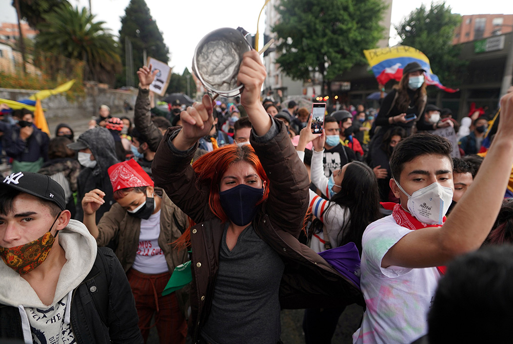 Demonstrators participate in a protest against poverty and police violence May 4 in Bogota, Colombia. (CNS/Nathalia Angarita, Reuters) Demonstrators participate in a protest against poverty and police violence May 4 in Bogota, Colombia. (CNS/Nathalia Angarita, Reuters)
